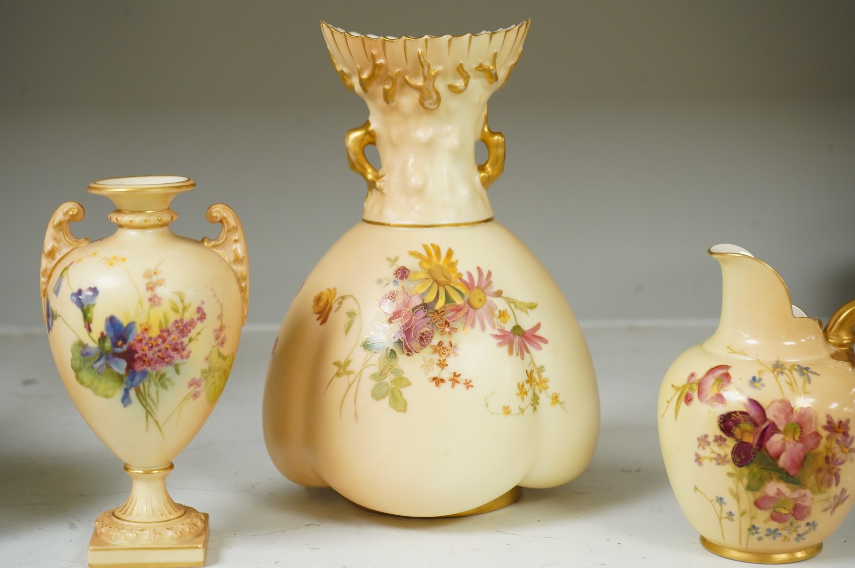 Three pieces of Royal Worcester blush ivory porcelain vessels, tallest 20cm